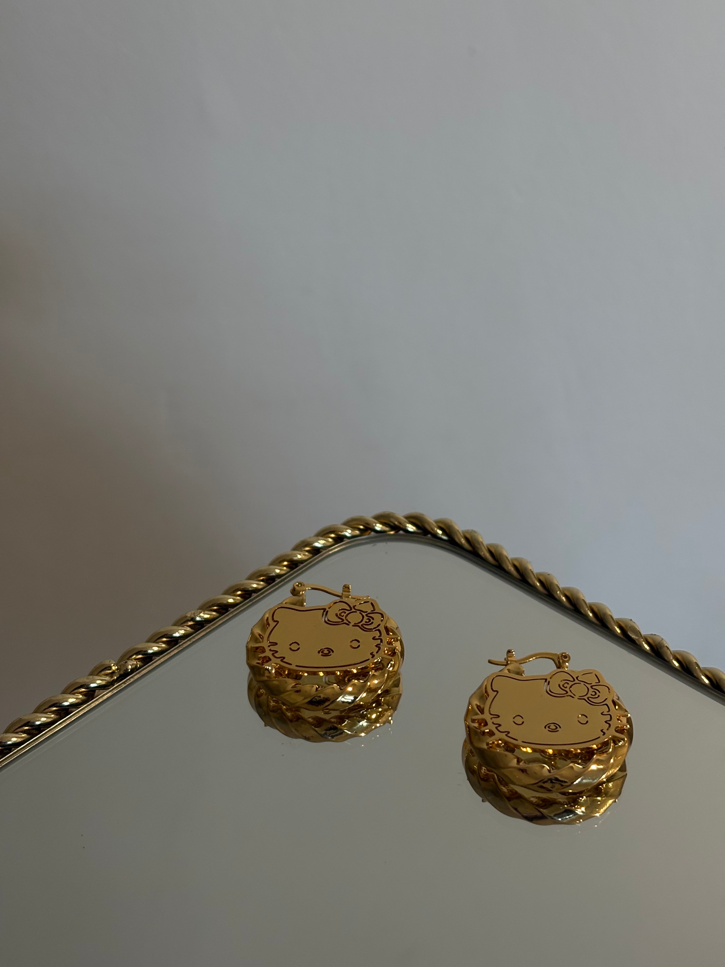 Twisted HK hoop earrings